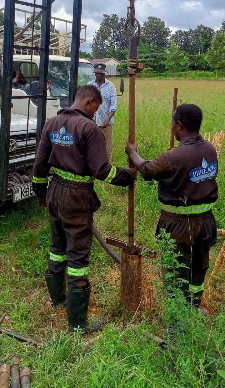 Phreatic technicians installing equipment on site
