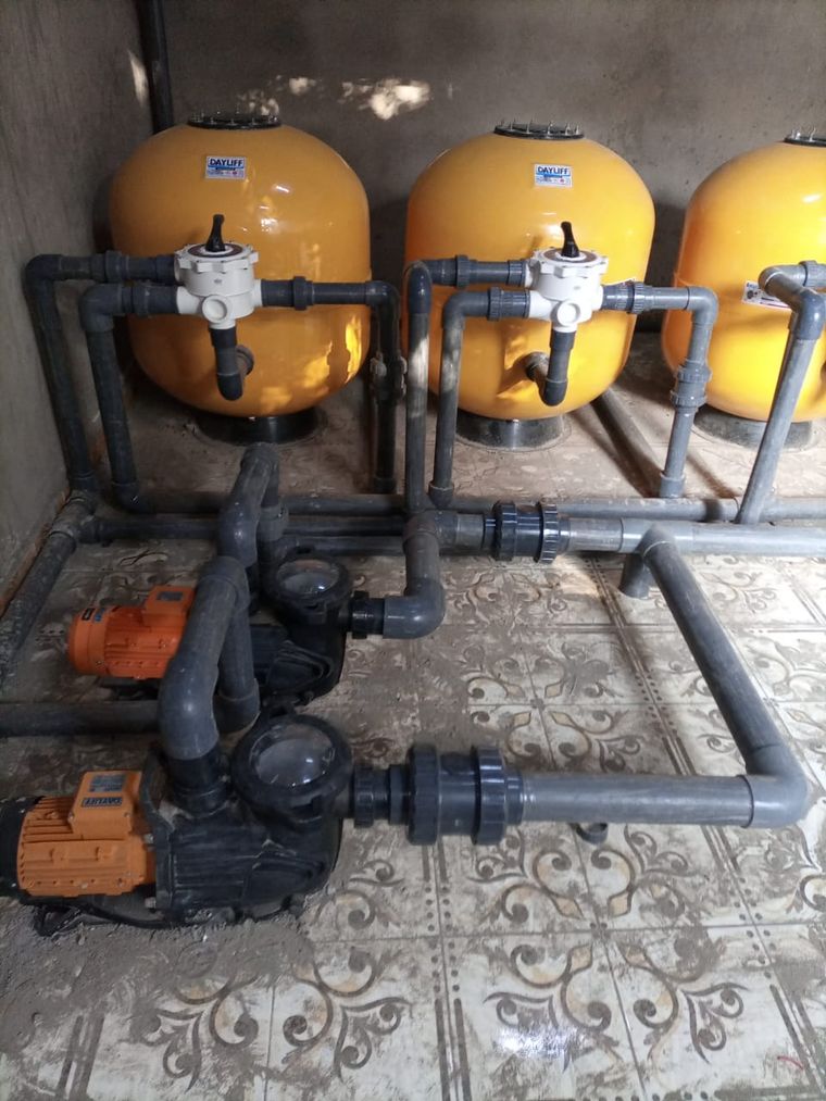 Pool circulation and filtration equipment being serviced