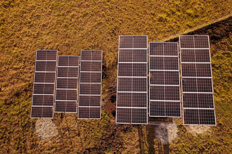 A ground-mounted solar array in an open field