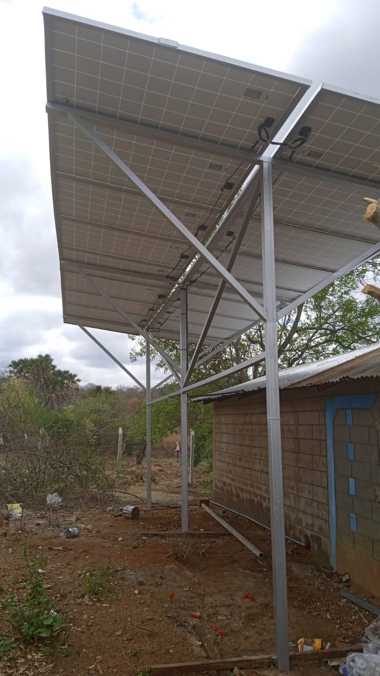 A ground-mounted off-grid solar panel array on its support frame
