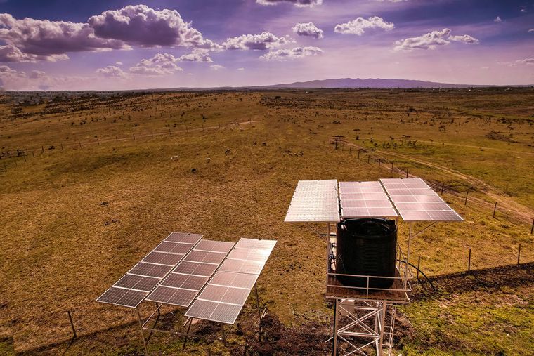 Solar panels beside an elevated water storage tank